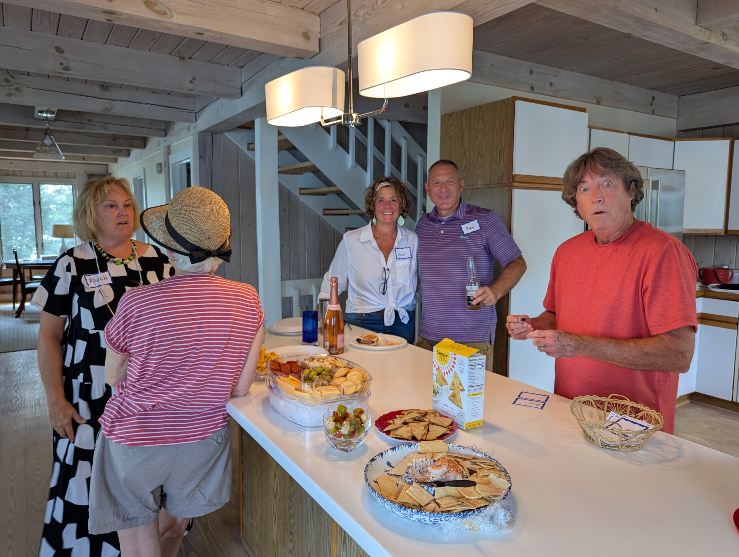 People enjoying snacks at a gathering.