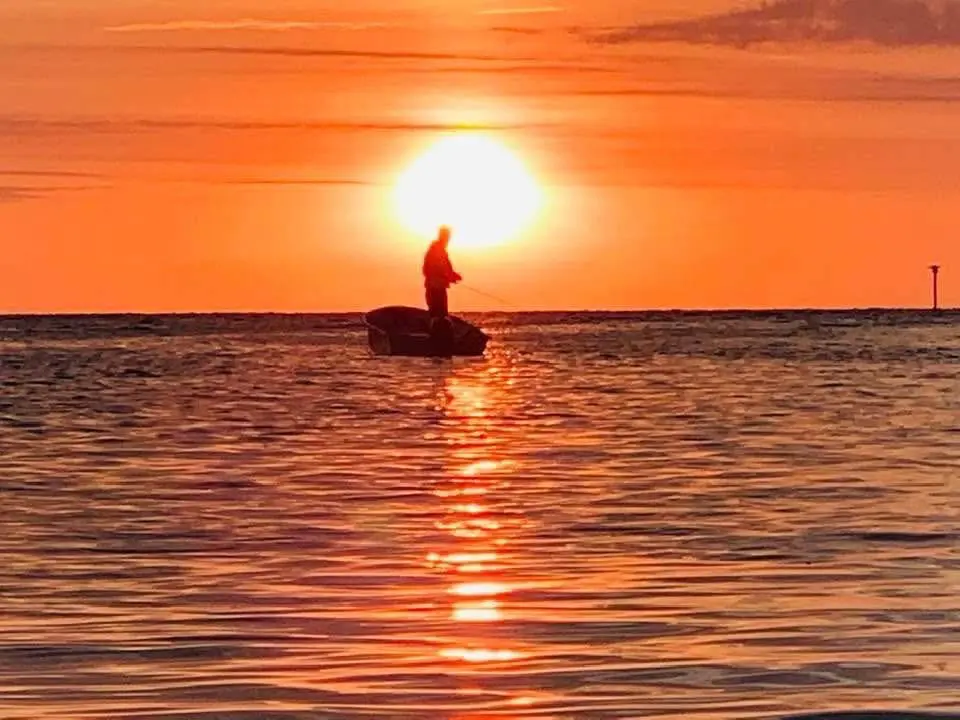 Man Fishing at Sunset